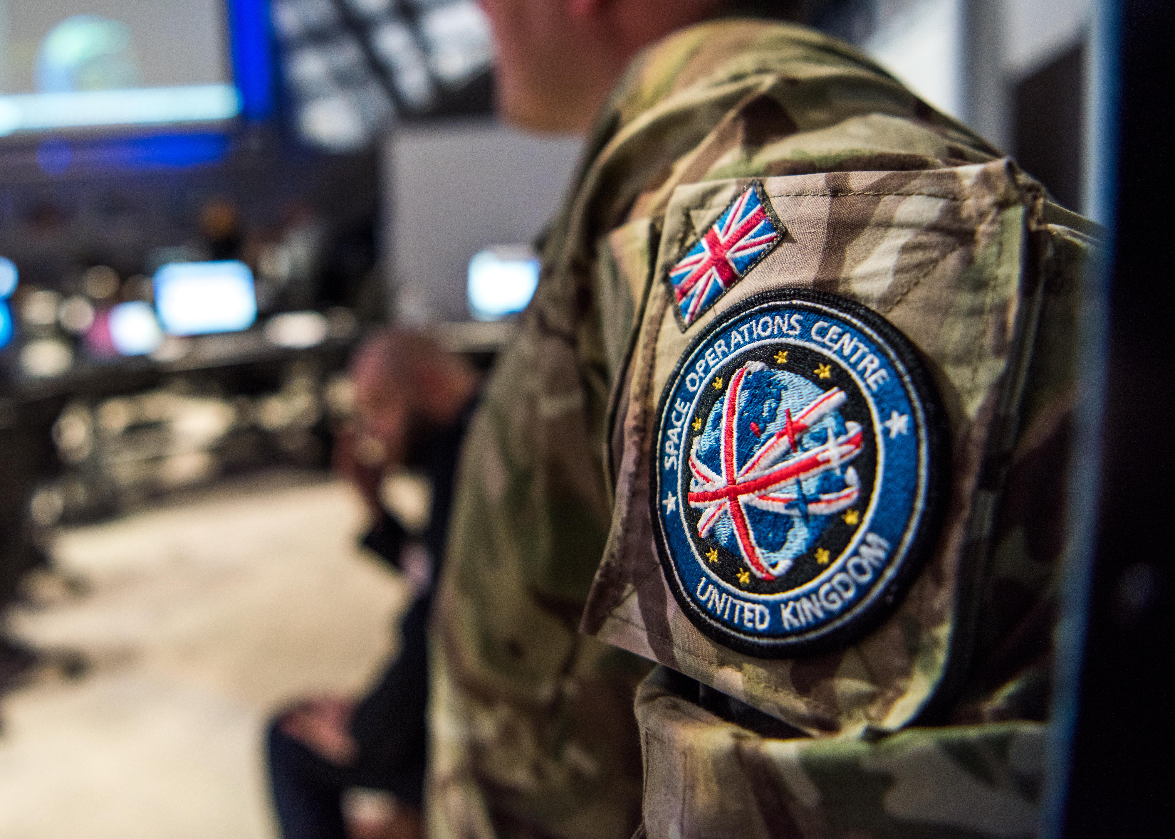 UK Space Command badge on uniform shoulder.